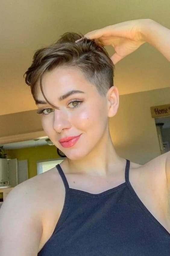 Bold and stylish funky pixie haircut ideas with undercut, long bangs, and red tones for confident women 2025